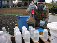 Dr. Leary preparing herbicides for a research trial.