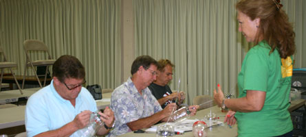 Workshop participants learn how to assemble fruit fly traps. 