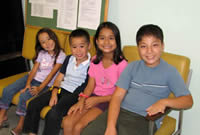 kids sitting on chairs