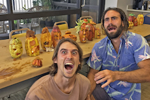 Colin Hart and Russell Galenti with carved cacao pods