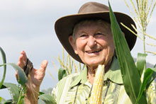 Dr. B smiling in a corn field