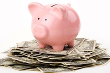 Piggy bank on stack of money