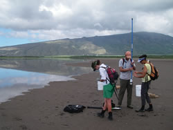 student sampling water