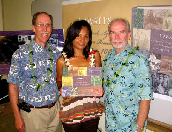 At the launch party for Hawaiis College of Tropical Agriculture and Human Resources: Celebrating the First 100 Years, editors Barry Brennan (left) and Jim Hollyer (right) and book designer Nancy Hoffman-Valies pose with their handiwork, a beautifully illustrated, 300-page history of CTAHR.