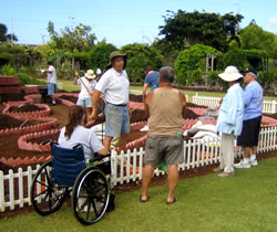 Master gardener talking to visitors