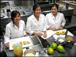 HNFAS students Kacie Ho, Kara Yamada, and Jennifer Shido (from left) in the midst of new product development in CTAHR’s food lab.