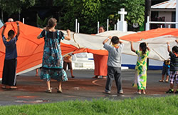 CHL staff and students in American Samoa play with a parachute to increase cardiovascular activity.
