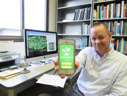 Scot
Nelson shows his Plant Doctor app, which was used to alert him to the coffee
virus displayed on his screen.