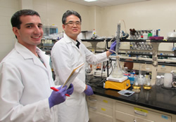 Eunsung Kan (right) and MS student Stuart Watson demonstrate
a system for neutralizing emerging contaminants.