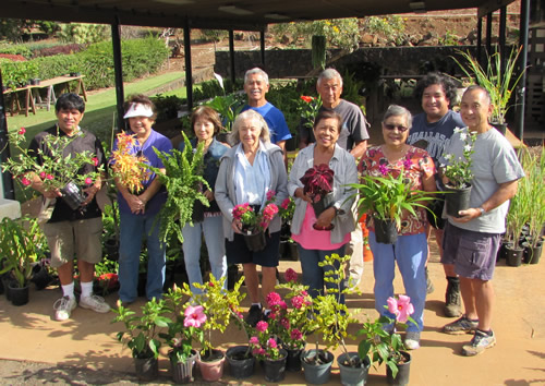 UGC  volunteers display the flourishing plants they have tended and will sell at an  upcoming Second Saturday at the Garden event.